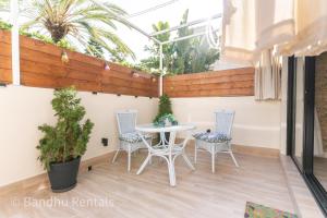 Coastal retreat with Private patio steps from beach