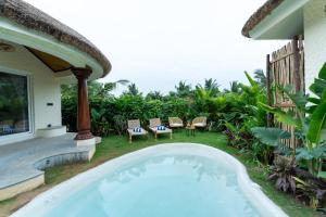 ELIVAAS Mallai Suites with Lush Lawn, Plunge Pool and Sit-Outs
