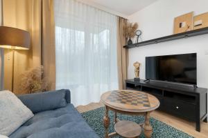 Modern Apartment with Garden and Parking in Gdańsk by Noclegi Renters