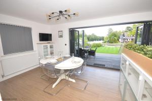 Rendezvous - stunning corner plot on the main river in Wroxham