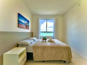 Apto Bal Picarras 150M PRAIA com PISICNA, Cozinha completa, sacada com CHURRASQUEIRA privativa, Wi Fi, PORTARIA 24h,vaga privativa de GARAGEM