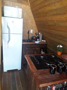 Chalé romântico com hidro, lareira e churrasqueira na Serra