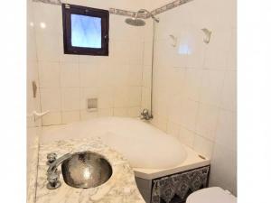 House steps from Playa Mansa with pool