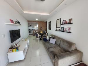 Apartamento vista mar e sacada com churrasqueira