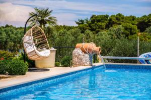 Beachfront House Mir with private pool and jacuzzi right at the beach in beautiful bay in Mirca - Brac