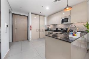 Easy access to Community Parks and Green Spaces,15 minutes drive to Miracle Garden - Rigel, JVC, by Deluxe Holiday Homes