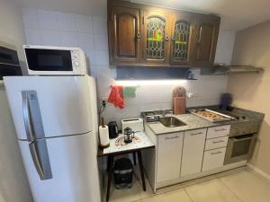 Studio featuring a private terrace with a grill