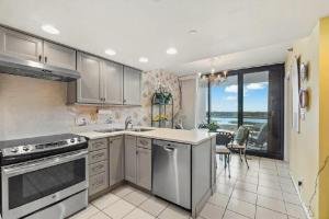 Bright Two-Bedroom Waterfront Retreat With Scenic Balcony Views