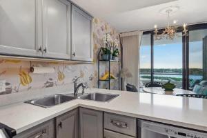 Bright Two-Bedroom Waterfront Retreat With Scenic Balcony Views