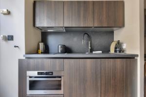 Merveilleux studio neuf proche Tour Eiffel avec AC