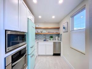 Seas The Day from this updated 2 bed 2 bath steps to beach