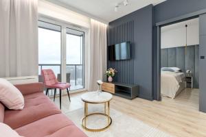 Elegant Apartment with Balcony and Underground Parking by Noclegi Renters