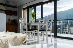 Sunny Apartment with Parking & Balcony with Mountain View by Noclegi Renters
