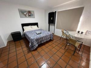 Habitación doble superior en el centro, con baño