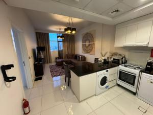 Premium 1BR Apartment In Damac Ghalia with City View & Balcony