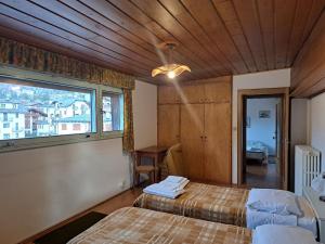 Luminoso e centralissimo attico, splendida vista panoramica sulle Dolomiti e sulle piste olimpiche