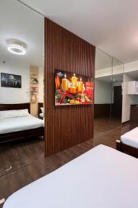 Relaxing Escape 2 Beds Rattan Chair & 65 inch Smart TV