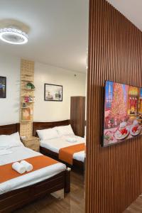 Relaxing Escape 2 Beds Rattan Chair & 65 inch Smart TV