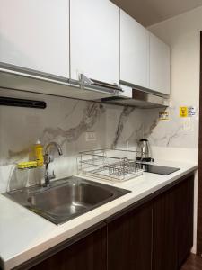 Relaxing Escape 2 Beds Rattan Chair & 65 inch Smart TV