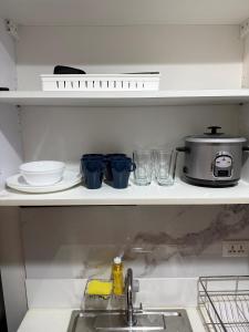 Relaxing Escape 2 Beds Rattan Chair & 65 inch Smart TV