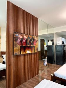 Relaxing Escape 2 Beds Rattan Chair & 65 inch Smart TV