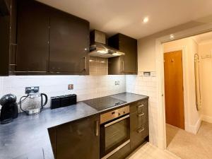 Riverside city-centre apartment with parking