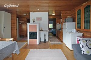 Riverside Cabin beneath the Northern Lights