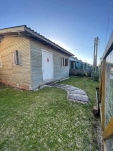 Casa pé na areia em capão da canoa