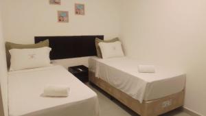 Hotel Rosa da Ilha Guaruja - 80m do mar, 02 piscinas, sala de jogos, brinquedão de percurso para crianças