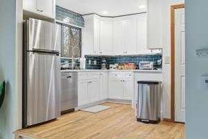 Monster-themed lake front cabin with firepit sauna hot tub game room