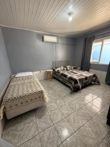 Casa de Praia da Zu com Pátio e Estacionamento