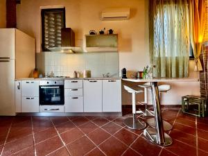 Cottage con piscina immerso nel verde delle crete senesi