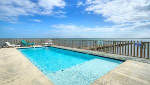 Balcony w Bay View Shared Pool Boat Dock Fat Flounder by AvantStay