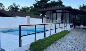 Two-story house in a gated community with a swimming pool