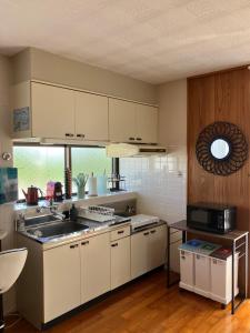 Sunkissed Divers Okinawa 1, Rooftop for 2 with Jacuzzi, Bbq and Sea View