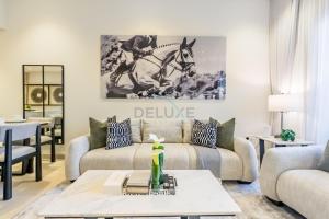 Balcony-Facing Pool 2BR with Assistant Room, Minutes Walk to Park, Miracle and Butterfly Garden, Divine Living, Arjan by Deluxe Holiday Homes
