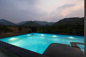 Vaikunth Villa 3-BHK Getaway with Rooftop Pool, Sit-out Area, Jacuzzi, Scenic Lake & Hill Views