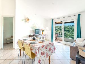 Complex surrounded by greenery with pool