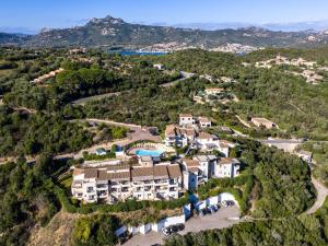 Complex surrounded by greenery with pool img19