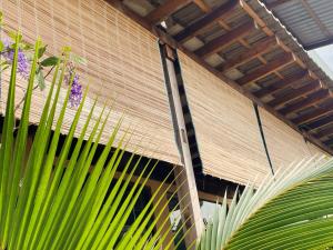 Here Library - A wooden home by the river with a library