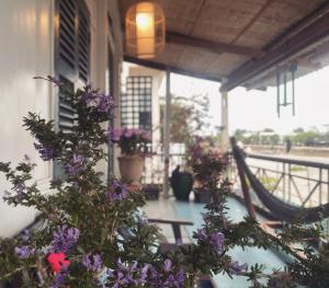 Here Library - A wooden home by the river with a library