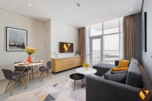 Vogue Vacation Homes, Novotel Residences JVT near Springs Souk Mall, One Bedroom apartment with Balcony and Vibrant Community View, Access toAmenities