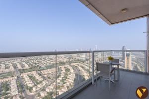 Vogue Vacation Homes, Novotel Residences JVT near Springs Souk Mall, One Bedroom apartment with Balcony and Vibrant Community View, Access toAmenities