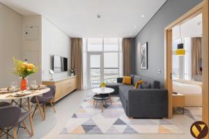 Vogue Vacation Homes, Novotel Residences JVT near Springs Souk Mall, One Bedroom apartment with Balcony and Vibrant Community View, Access toAmenities