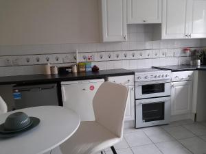 Four-bedroom house, kitchen, TV in each bedroom