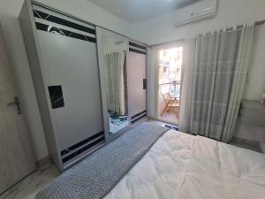 Modern Pool View 1BR with Balcony Prime Location on Hurghada Vibrant Promenade