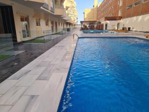 Modern Pool View 1BR with Balcony Prime Location on Hurghada Vibrant Promenade