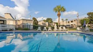 Steps from the Sand Bright Coastal Stay w Pool Access Coastal Hideaway by AvantStay