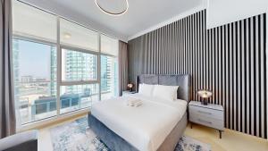 Vacationer Holiday Homes l Cozy 1 Bed l Partial Sea View l Prime Location