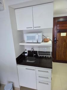 Araça Praia Flat, apartamento 203, Frente mar, Pe na areia!!!!!